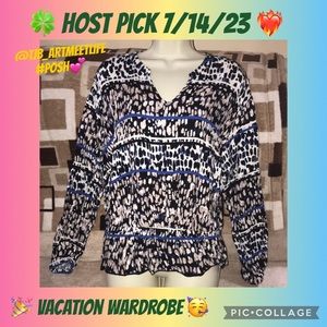 Jennifer Lopez Medium brown black white blue V neck long sleeved shirt